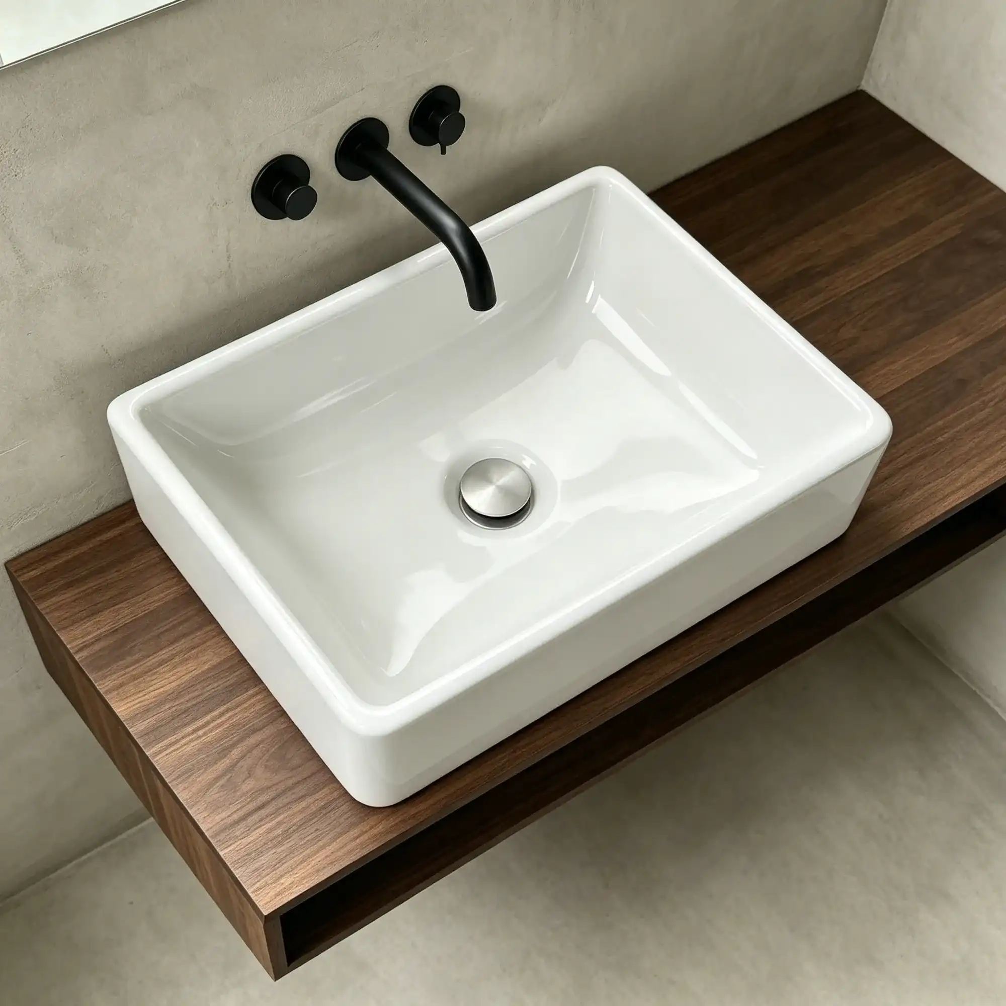 Modern bathroom featuring a compact rectangular ceramic countertop basin for hospitality and residential applications